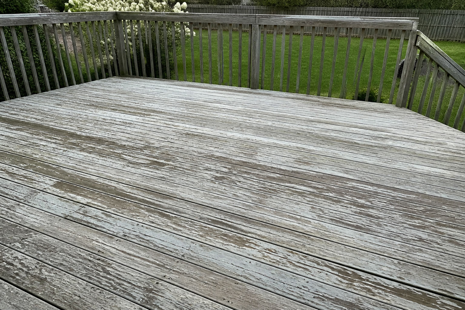 Weathered peeling deck before refinish